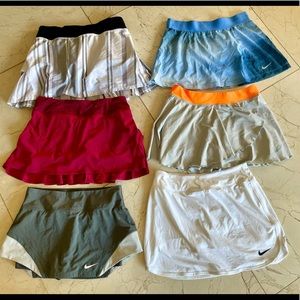 Lot of 7 tennis skirts. 3 Lululemon, 4 Nike.
